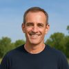 Roger Wheatley of BlogLogistics smiling outdoors, representing approachable and professional WordPress and hosting services.